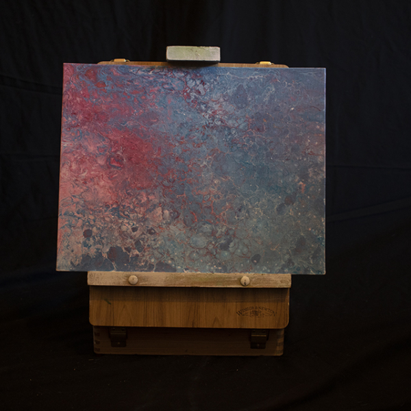 pink and blue acrylic pour on easel